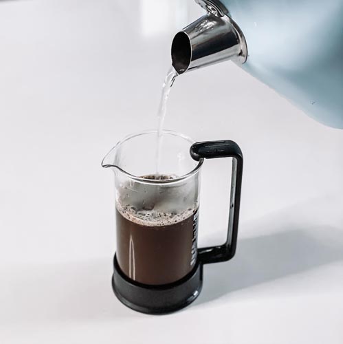 Hot water pouring into a french press