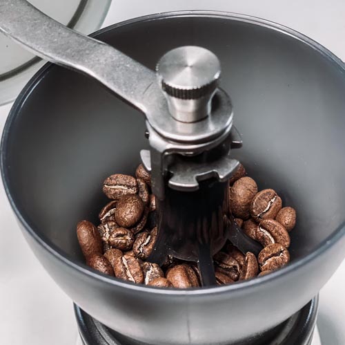 A manual coffee grinder, view from inside